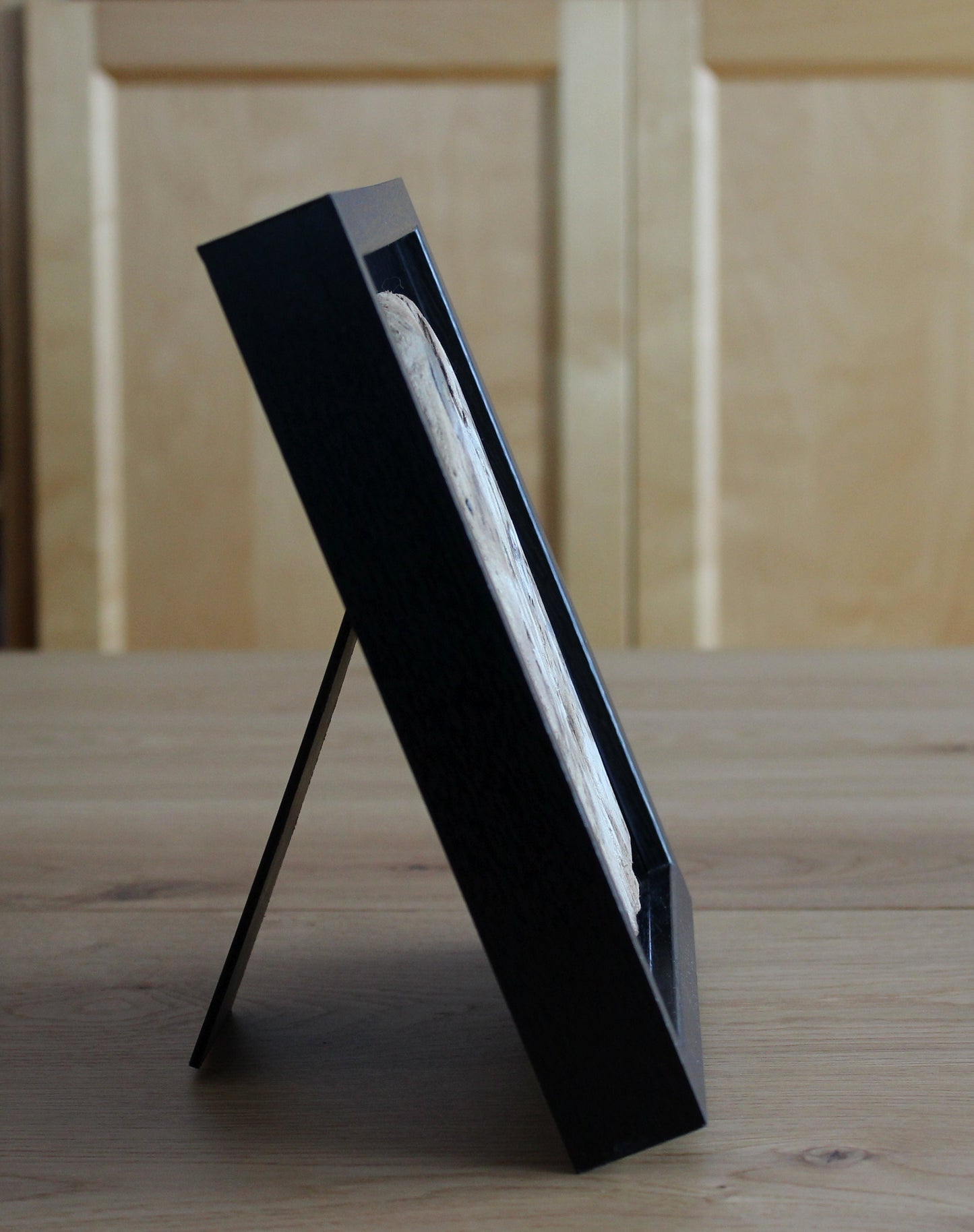 Icelandic ram.Acrylic painting on driftwood in a black frame.