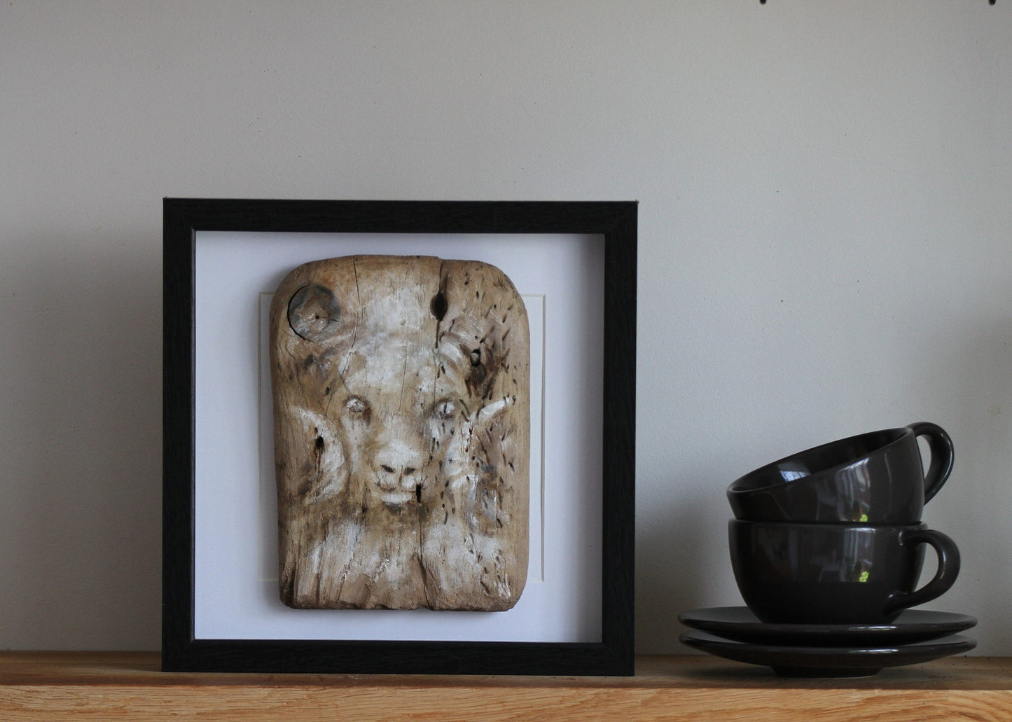 Icelandic ram.Acrylic painting on driftwood in a black frame.
