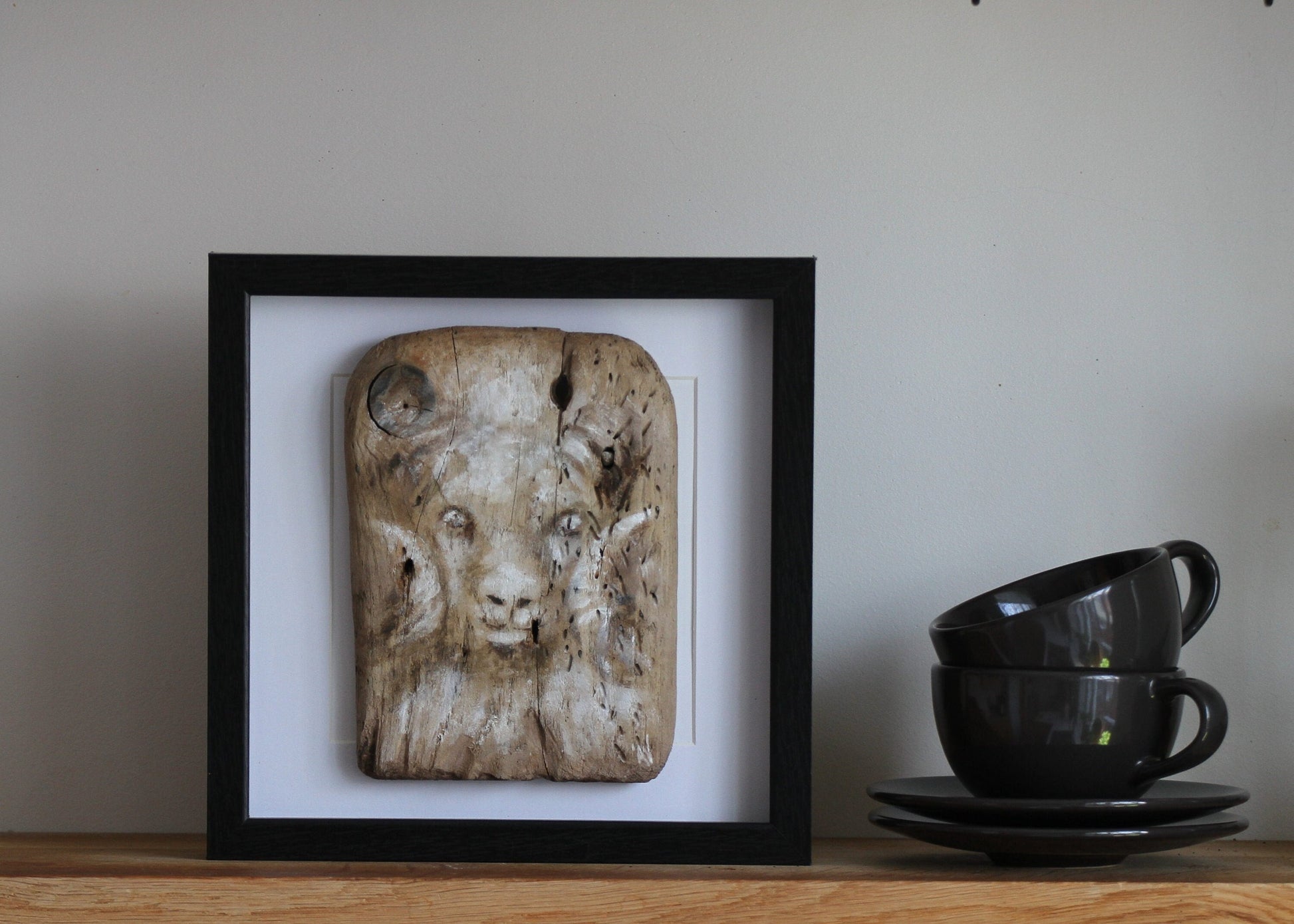 Icelandic ram.Acrylic painting on driftwood in a black frame.