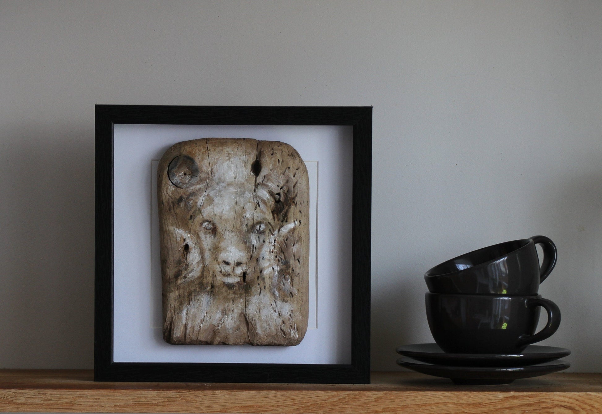 Icelandic ram.Acrylic painting on driftwood in a black frame.